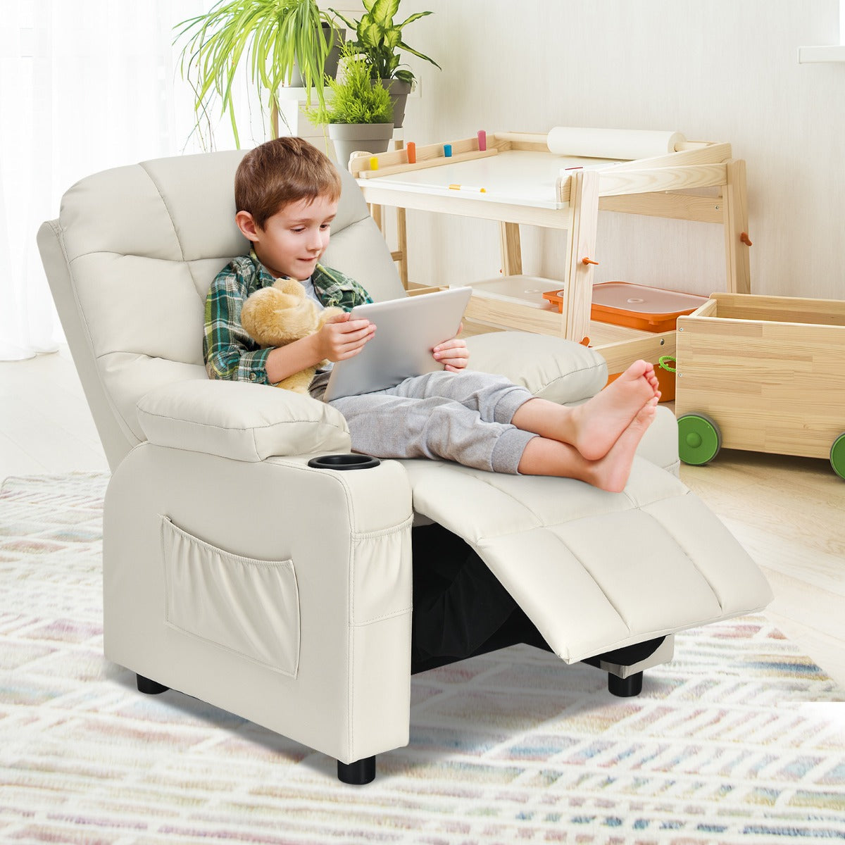 Kids beige leather recliner chair with cup holder, providing comfort and style for children.