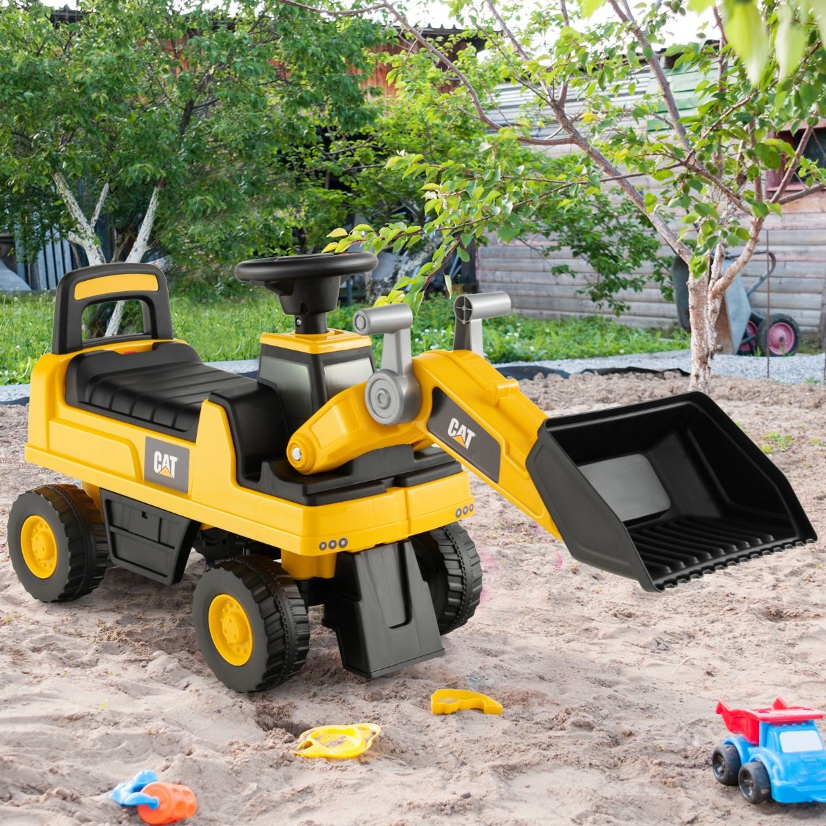 Yellow kids ride-on excavator bulldozer truck with bucket for imaginative play at home.