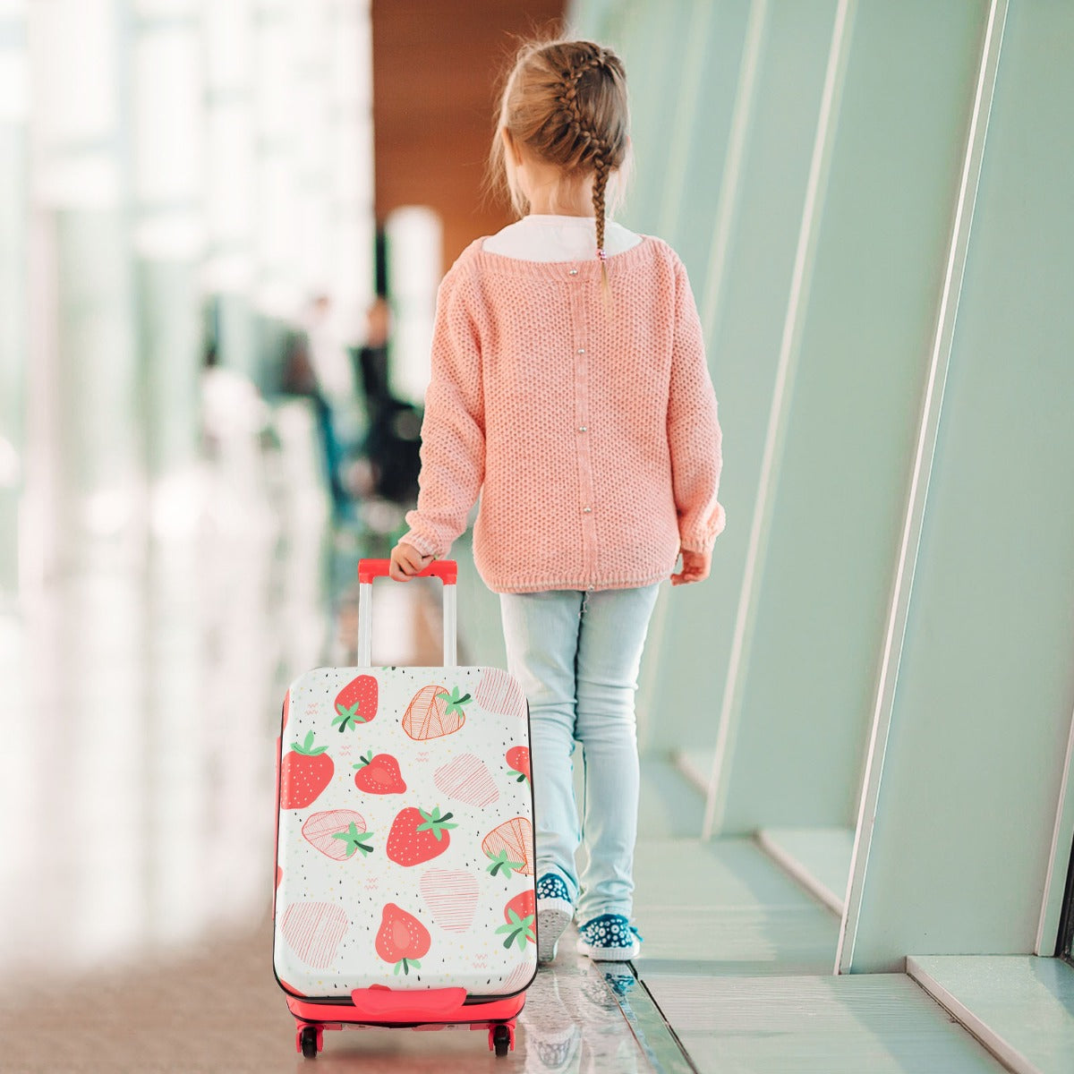 Kids 20 foldable hardshell carry-on suitcase in pink with dinosaur design and wheels