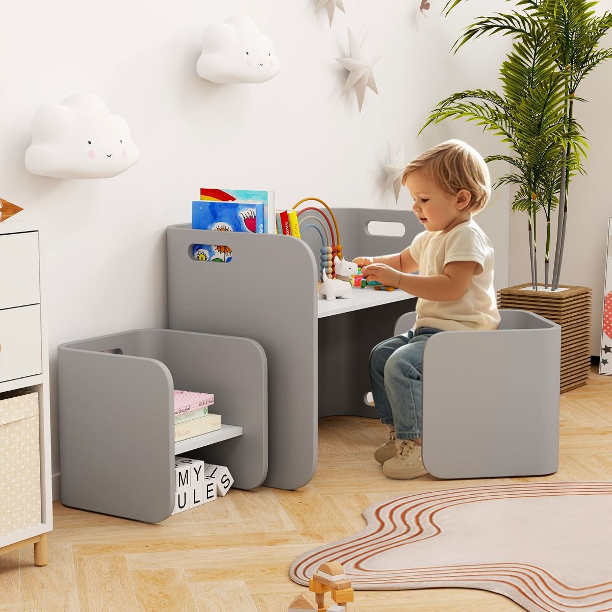 Childrens birch wood table and chair set with grey storage shelves for organized play and learning activities.