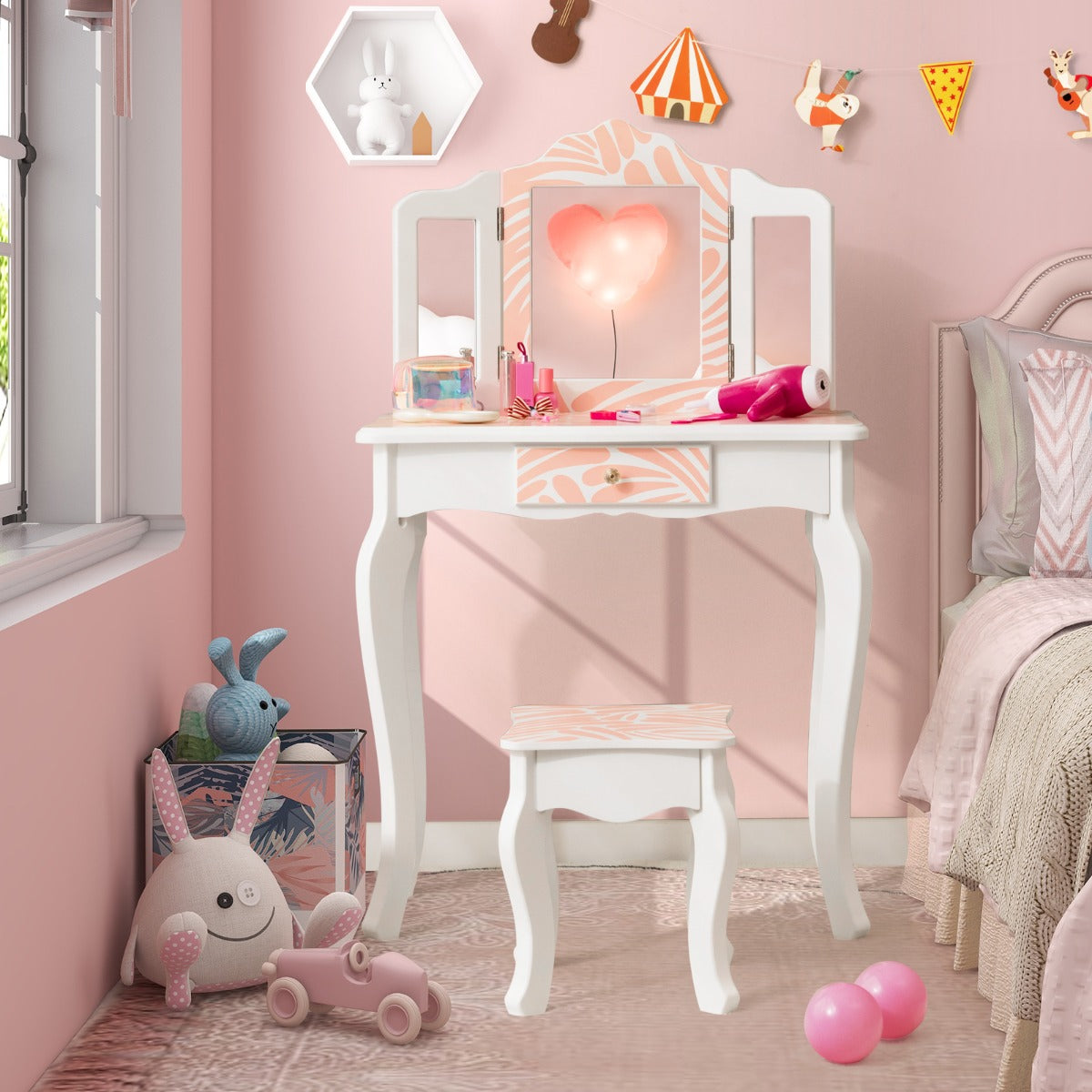 Kids vanity set in pink snowflake design, with mirror and stool for girls bedroom.