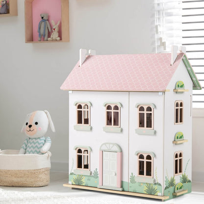 Pink wooden dollhouse for children features double-sided roofs and functional doors, encouraging imaginative play