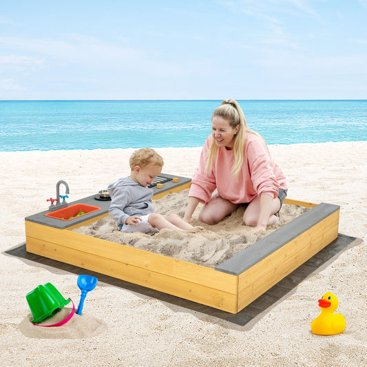 Wooden sandbox with kitchen playset, ideal for outdoor imaginative play for kids at home.