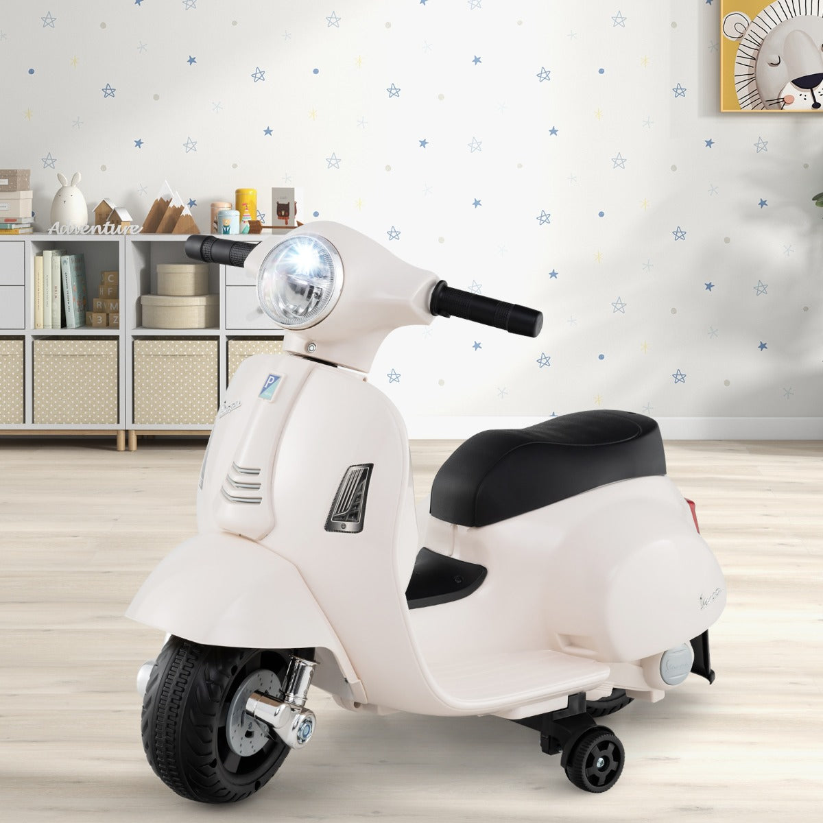 White Vespa-style ride-on motorcycle for children features LED headlight and 6V motor for realistic play.