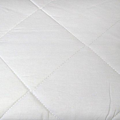 Kids cotton mattress protector with diamond quilted design for cozy protection.