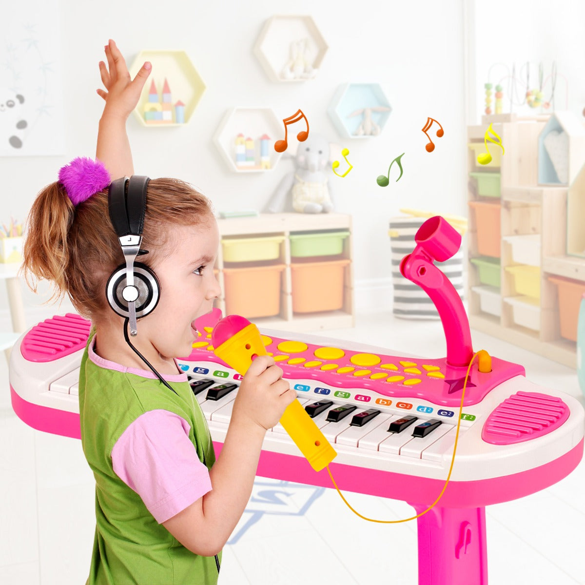 Pink electronic keyboard for children features 31 keys and includes a matching stool for musical play