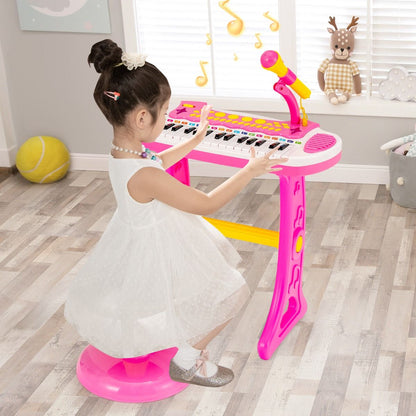 Pink electronic keyboard for children features 31 keys and includes a matching stool for musical play