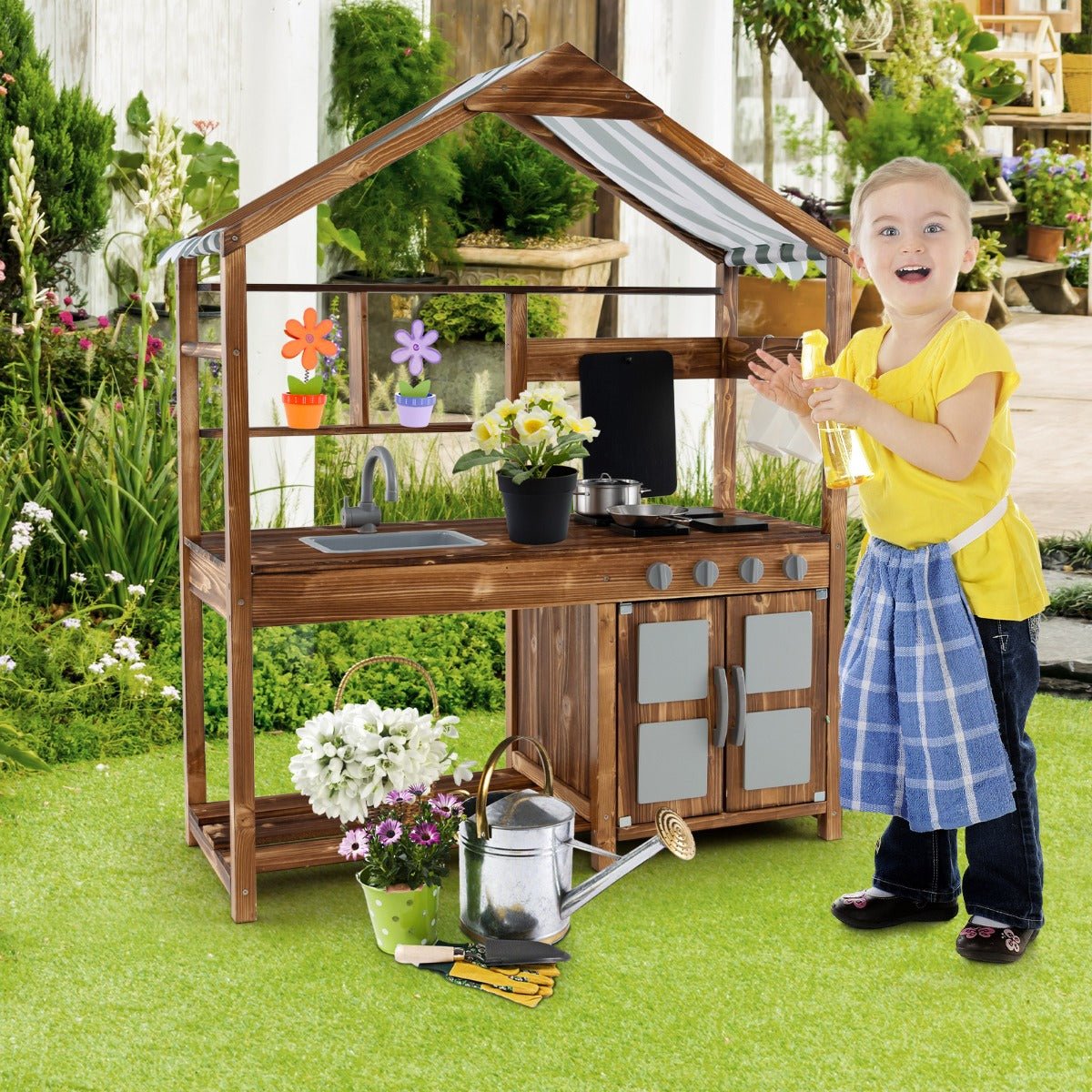 Kids outdoor wooden mud play kitchen with storage for imaginative outdoor play at home.