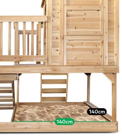 Wooden cubby house with rock wall and sandpit for endless outdoor play fun.