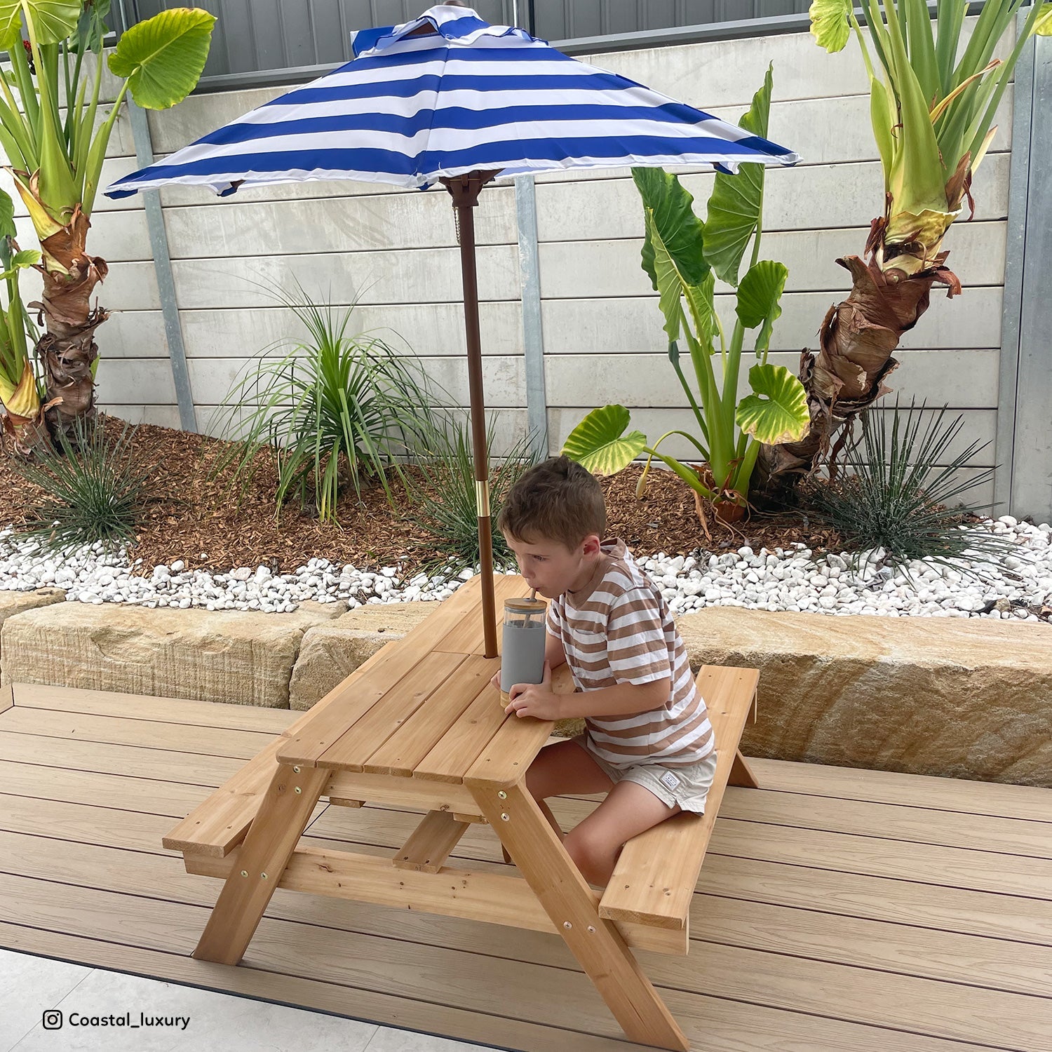 Lifespan Kids Sand and Water Table with Umbrella, perfect for outdoor play and exploration.