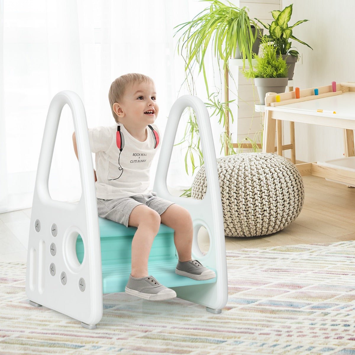 Blue toddler step stool with anti-slip surface and safety armrests for secure home climbing.