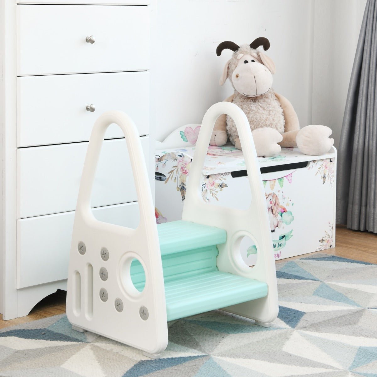 Blue toddler step stool with anti-slip surface and safety armrests for secure home use.