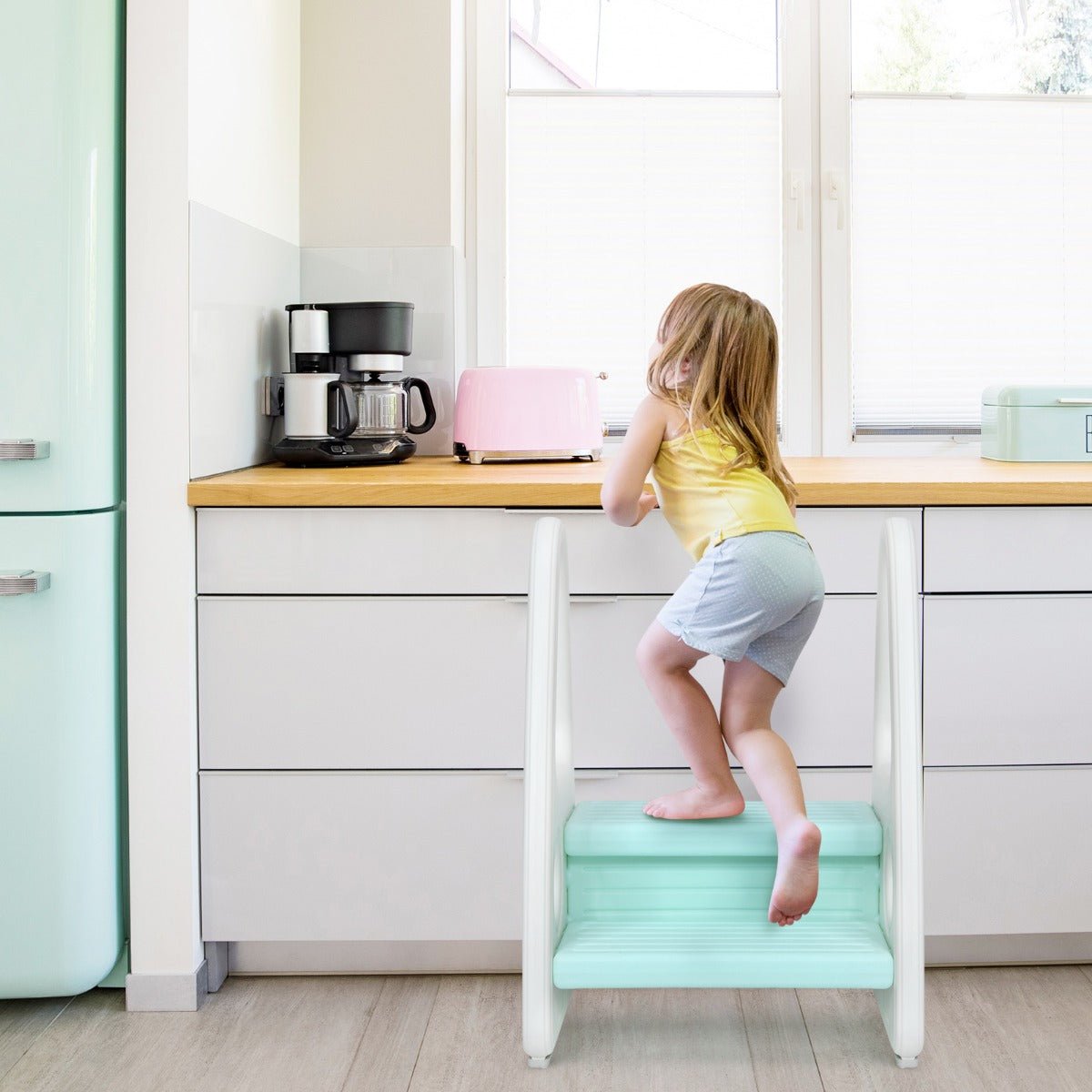 Blue toddler step stool with anti-slip surface and safety armrests for secure home use