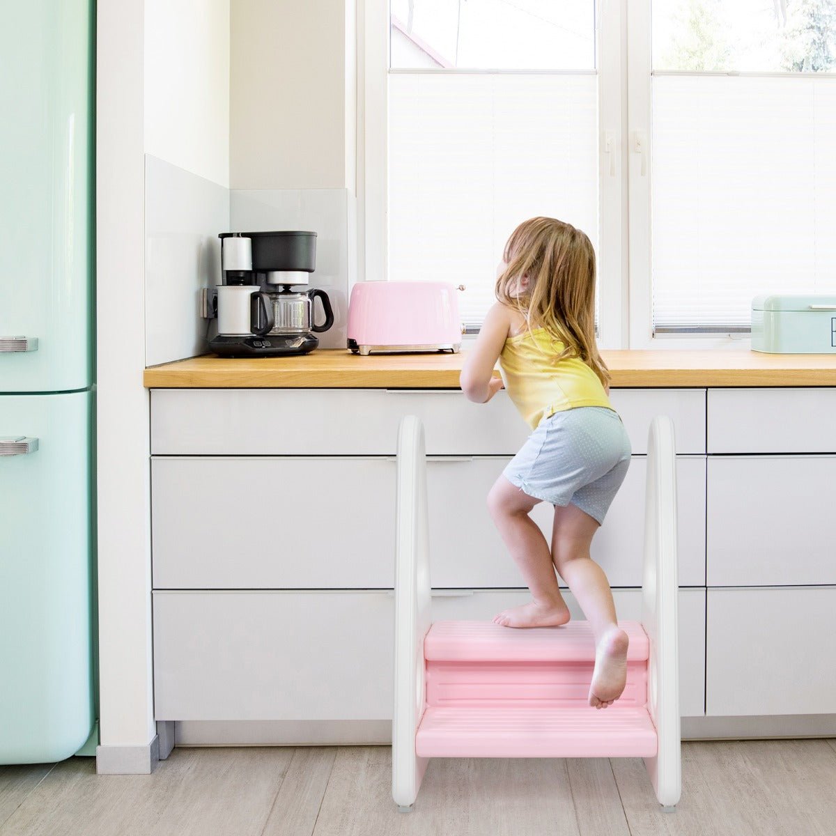 Pink toddler step stool with anti-slip surface for safe and easy access at home.