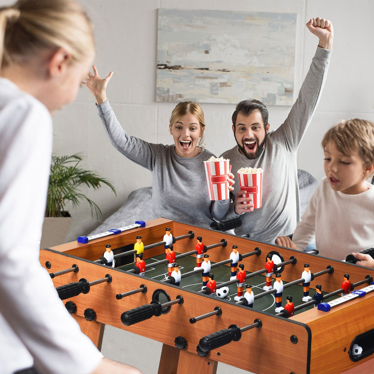 Compact foosball table set with kid-friendly design, perfect for indoor gaming fun at home.