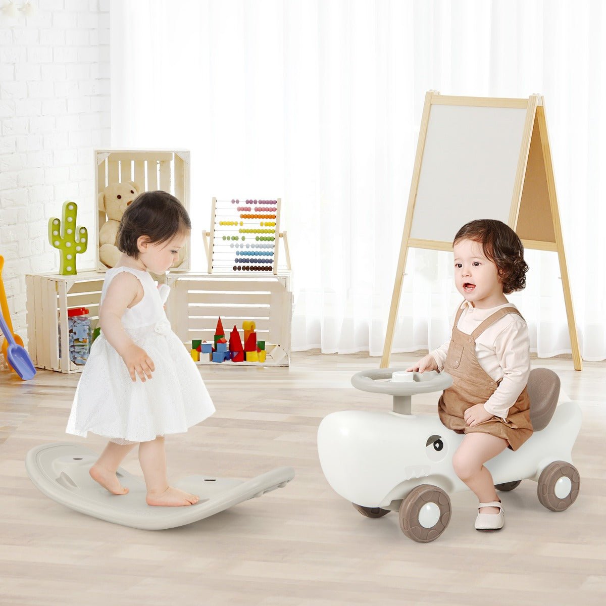Versatile 3-in-1 kids toy with rocking pony, balance board, and slide car in white.