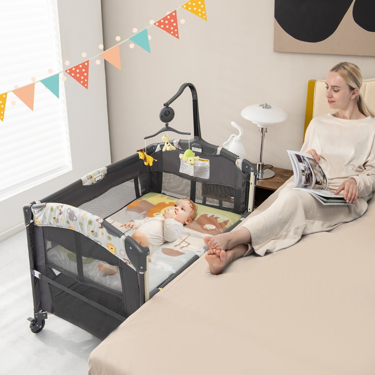 Grey 4-in-1 Convertible Baby Nursery Center and Playard for versatile child play and rest.