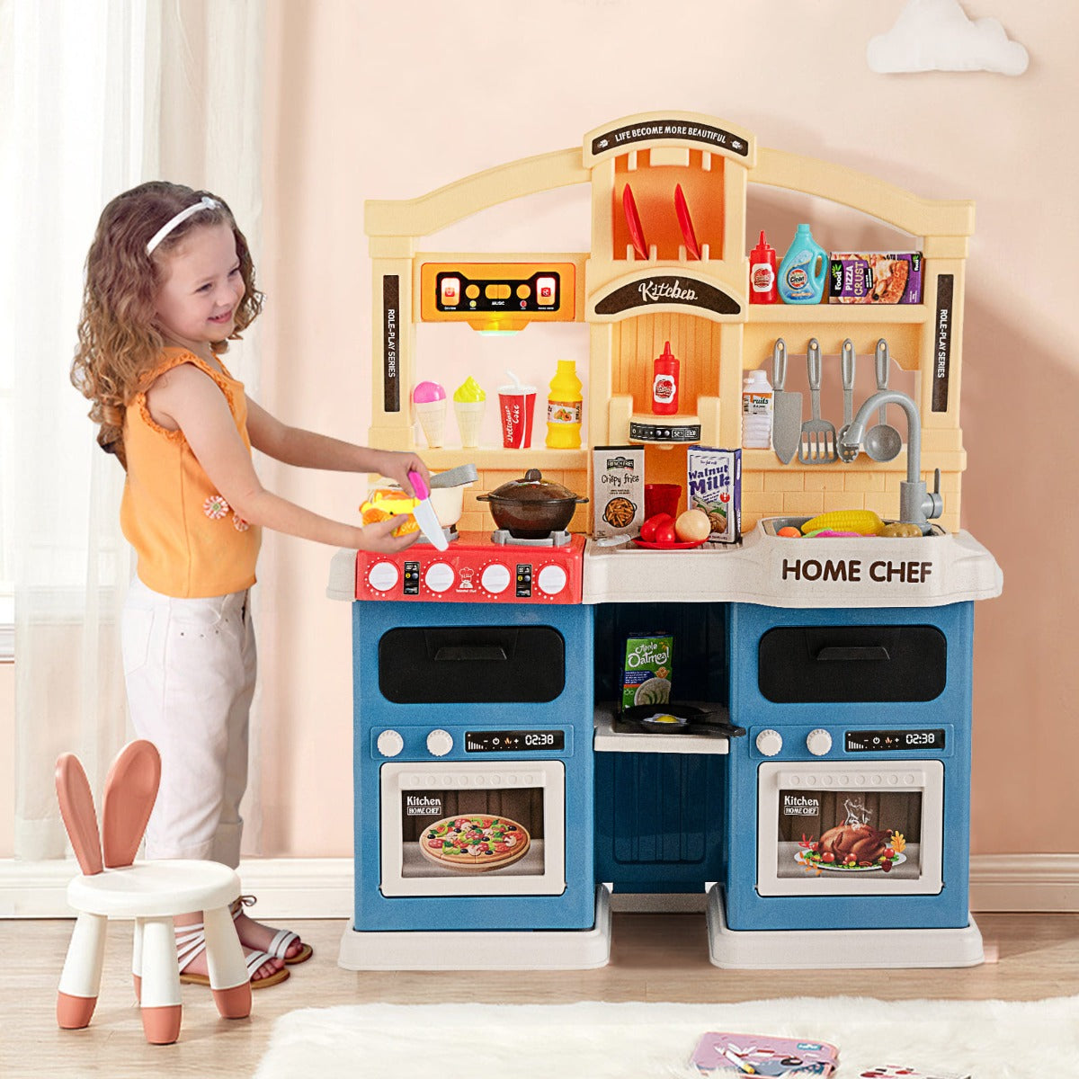 Blue kids kitchen playset with 69 pieces, lights, and sounds for interactive cooking fun.