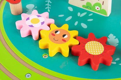 Multi-activity table for kids with bead maze, train track, and shape sorter. Encourages interactive play.