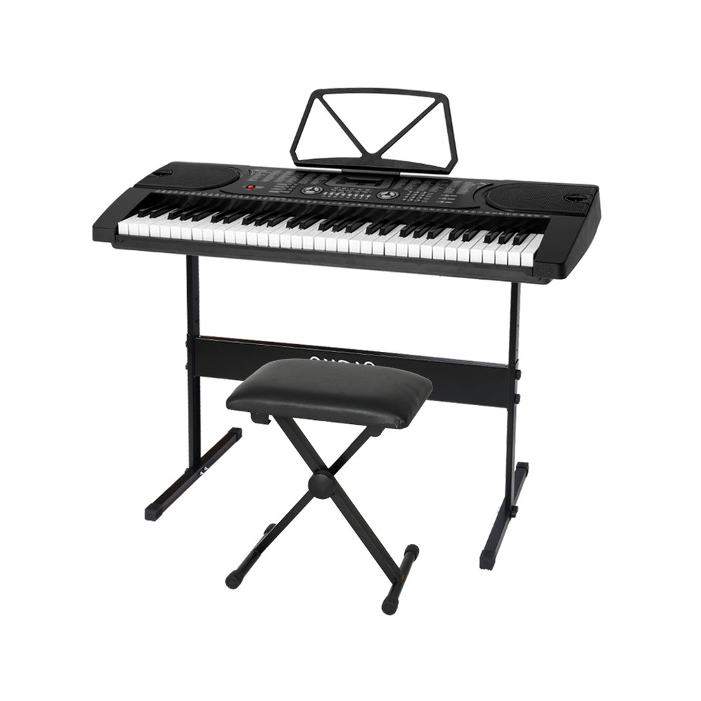 Black electric piano keyboard with stand and stool for childrens music learning and practice.