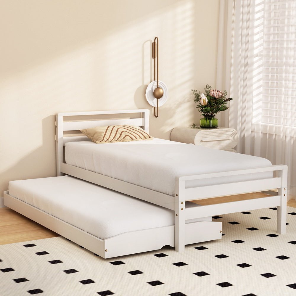 White wooden single bed frame with 2-in-1 trundle, ideal for childrens bedroom.