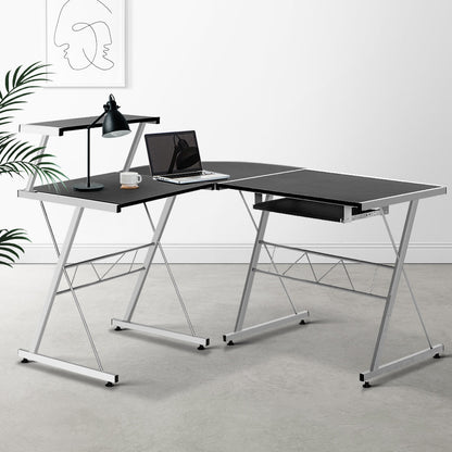 Modern L-shaped black desk for kids and adults, ideal for home offices and studies.