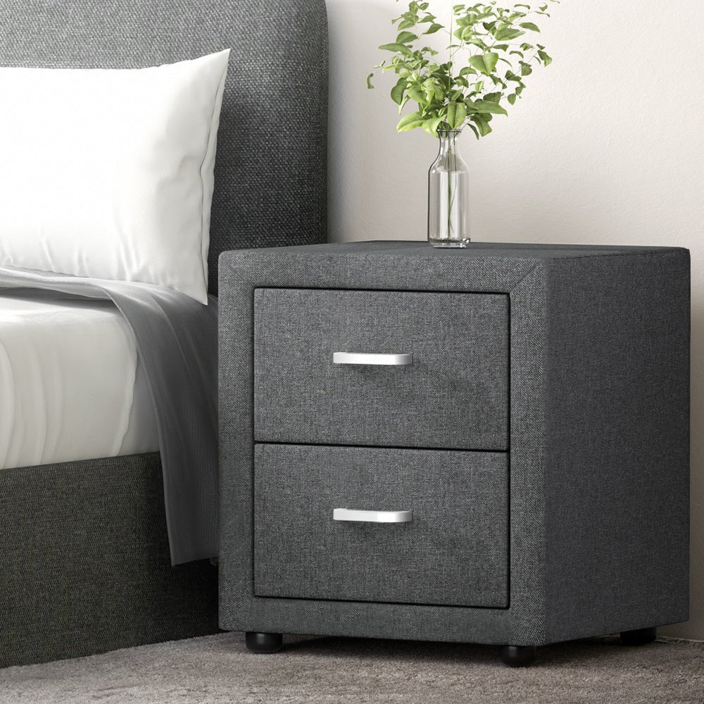 Grey fabric bedside table with storage. Perfect for childrens bedroom decor and organization.