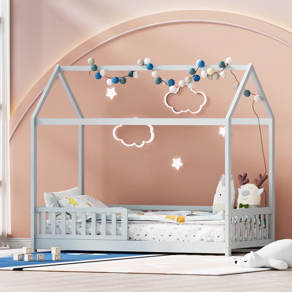 House-shaped pine bed frame in grey, ideal for single-size childrens room decor.