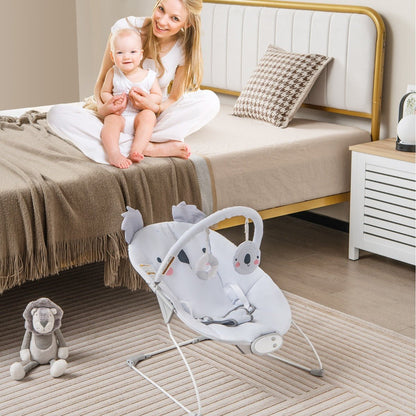 Infant bouncer with music and toys for soothing baby rocking experience at home.