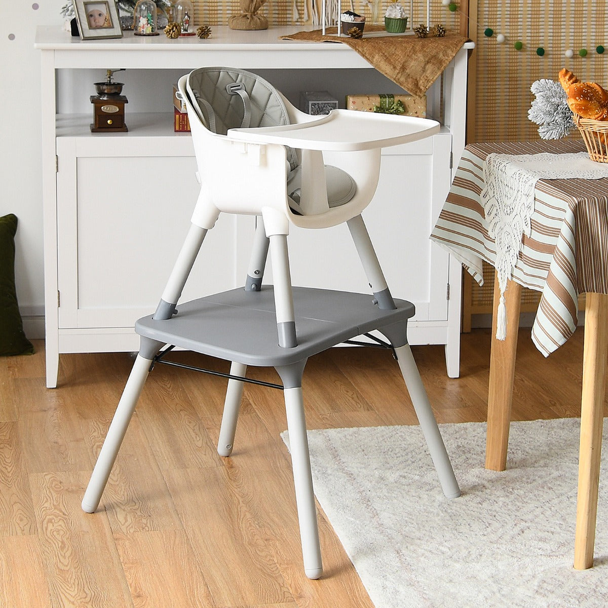 Grey 5-in-1 Convertible Baby Highchair with safety harness - versatile and secure dining solution.