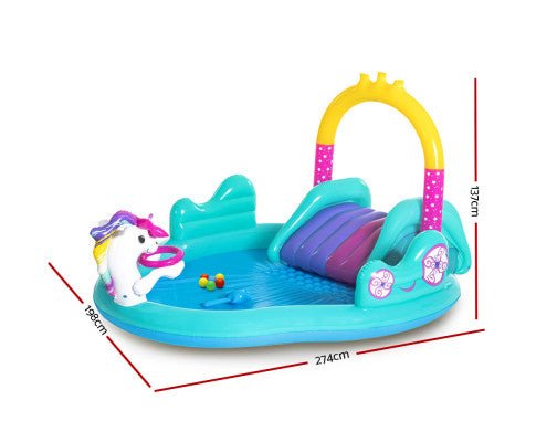 Colorful inflatable unicorn pool with slide for kids, perfect for backyard summer fun.