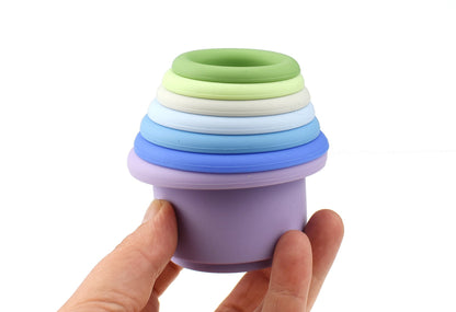 Blue 7-piece silicone stacking cups set for fun and educational play at home.