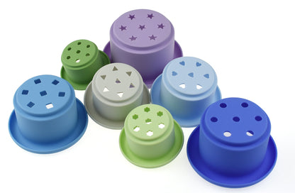 Silicone stacking cups set in blue, 7 pieces for engaging and educational play at home.