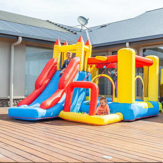 Inflatable jumping castle with slide and basketball hoop for kids active backyard fun.