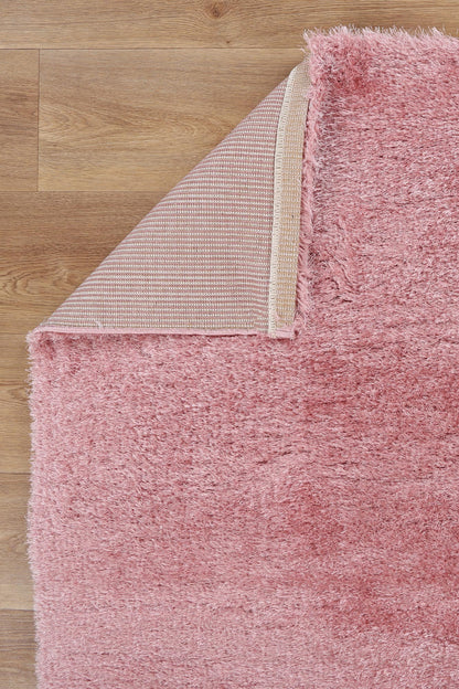 Soft and pink shaggy rug for kids rooms, adding cozy charm and comfort.