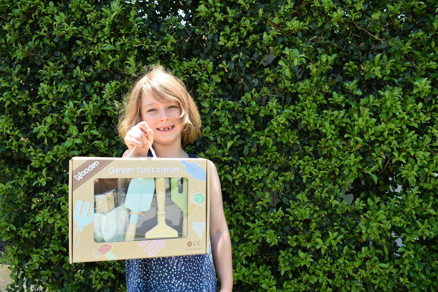 Kids garden tool apron with calming design, perfect for little helpers in the garden.