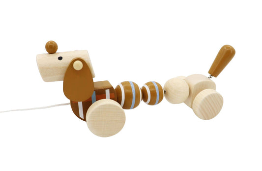 Pull along sausage dog toy, perfect for childrens play, promoting calmness and imaginative fun.