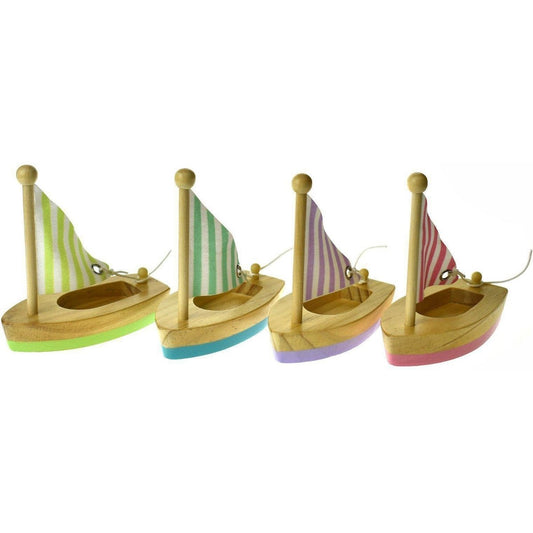 Small wooden sailboat toy for kids, promoting calm and imaginative play at home.