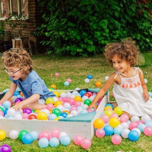 Plum teal wooden sandpit with cover for kids, provides hours of creative play at home.