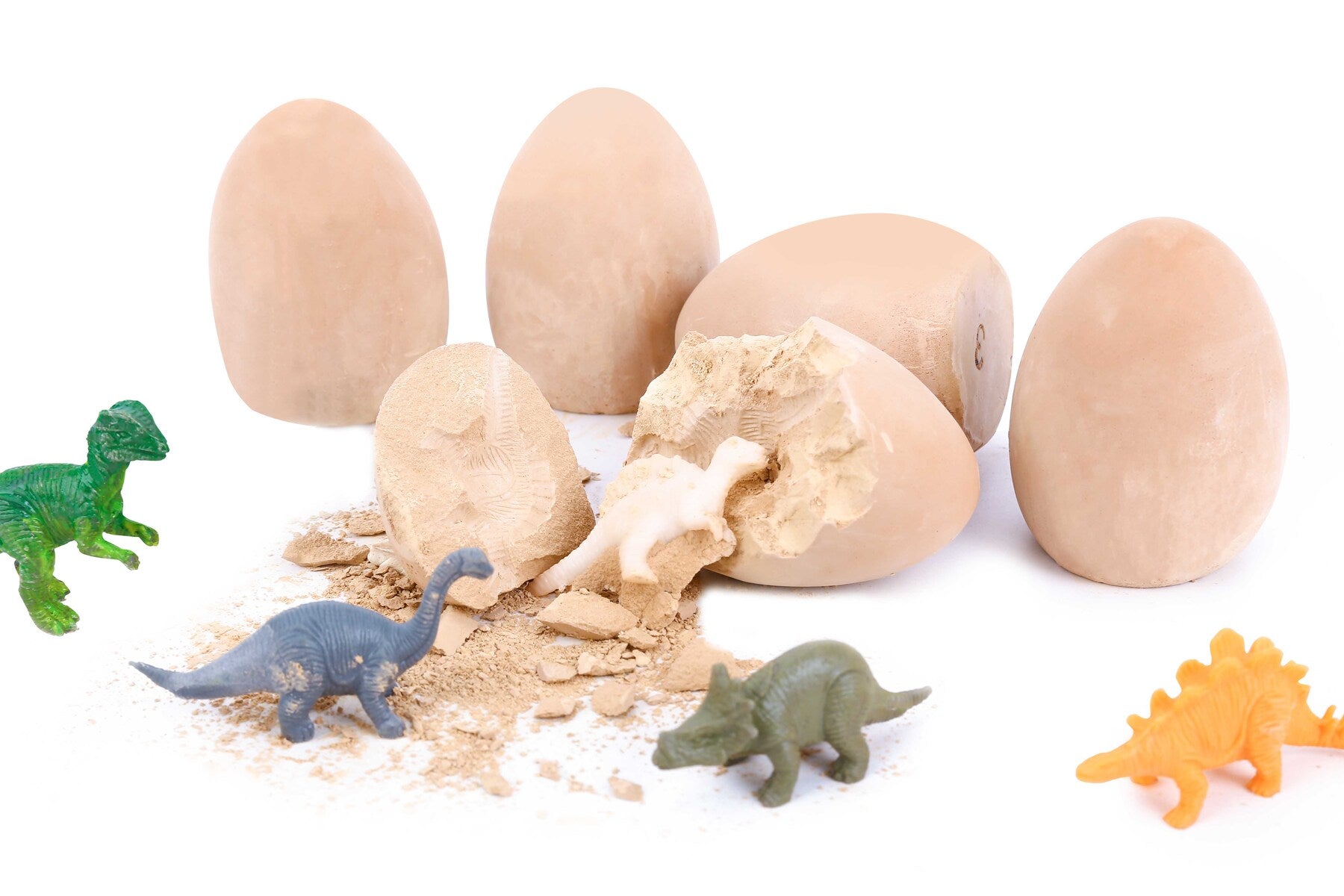 Interactive dinosaur egg dig kit for kids to unearth and discover fossils at home.