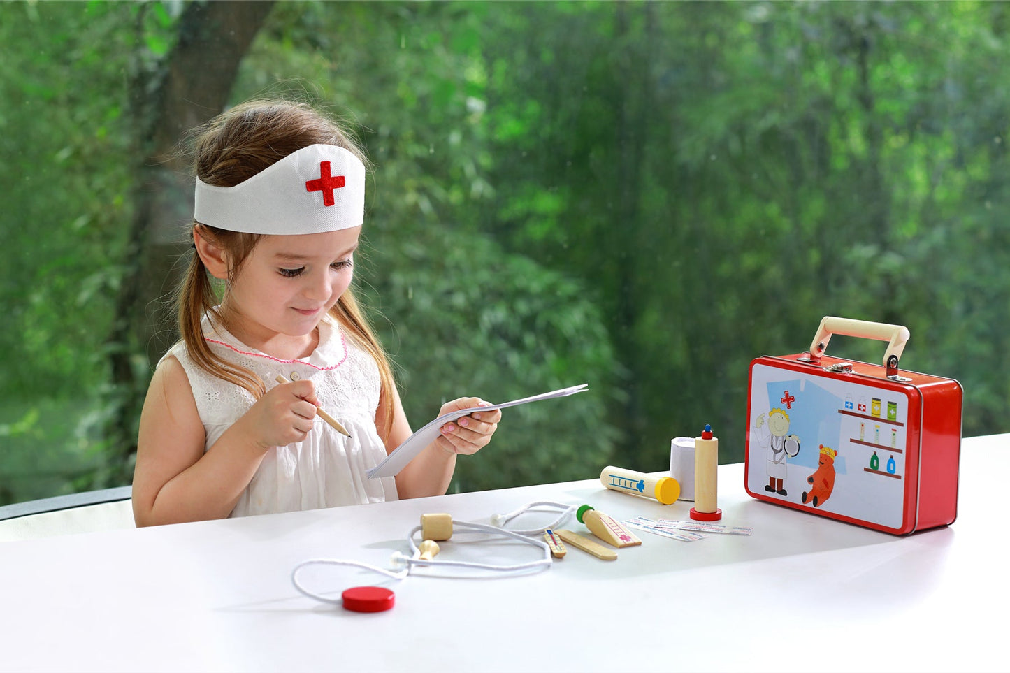 Kids doctor set in portable tin case for imaginative play at home.