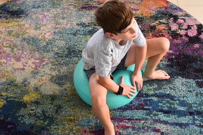 Green Donut Balance Ball, engaging exercise tool for kids, promotes balance and core strength.