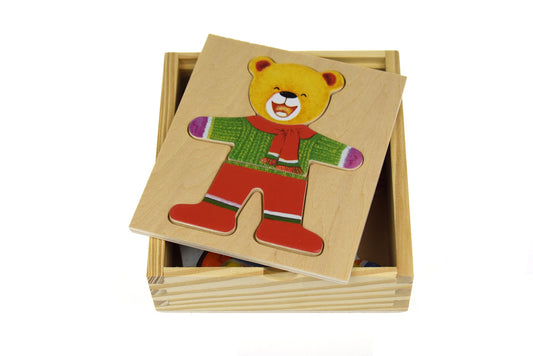 Adorable boy bear figurine in charming dress, ideal for kids room decor and playtime.