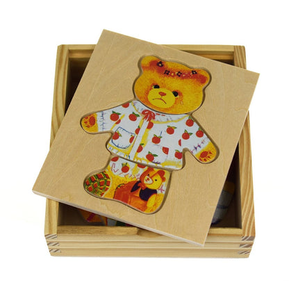 Adorable soft plush bear girl doll wearing stylish dress for imaginative play at home.