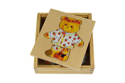 Adorable soft plush bear girl doll wearing stylish dress for imaginative play at home.