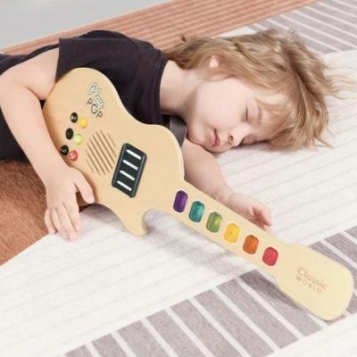 Classic World Electric Glowing Guitar lights up for imaginative play, perfect for kids at home.