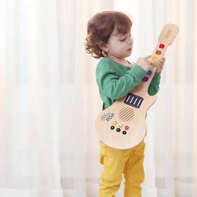 Electric Glowing Guitar for Kids by Classic World, ideal for play at home.