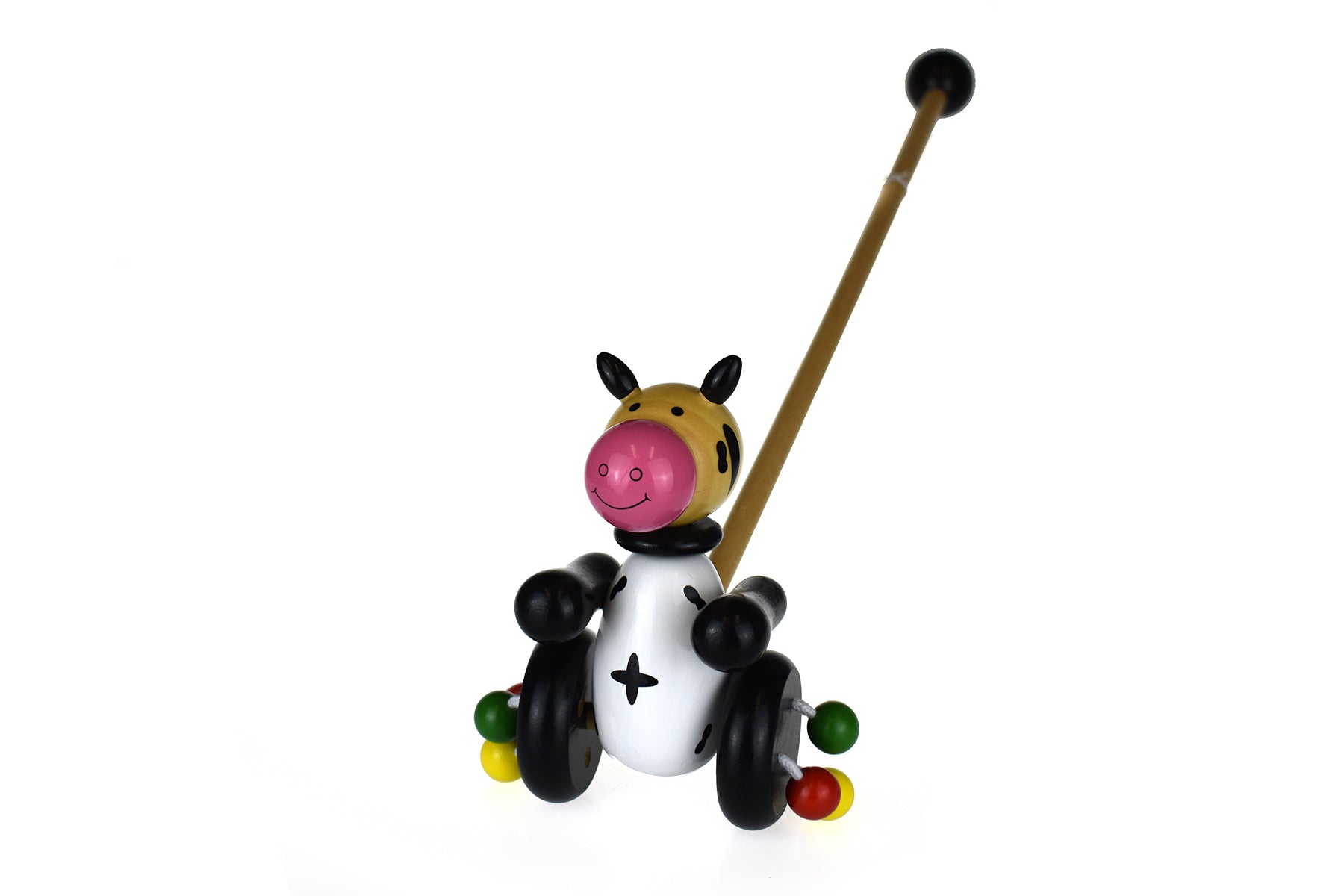 Wooden cow push toy for toddlers, promoting motor skills and imaginative play at home.