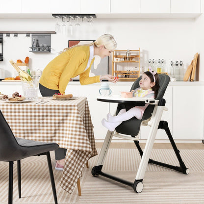 Foldable high chair with recline and wheels for adjustable comfort and convenience.