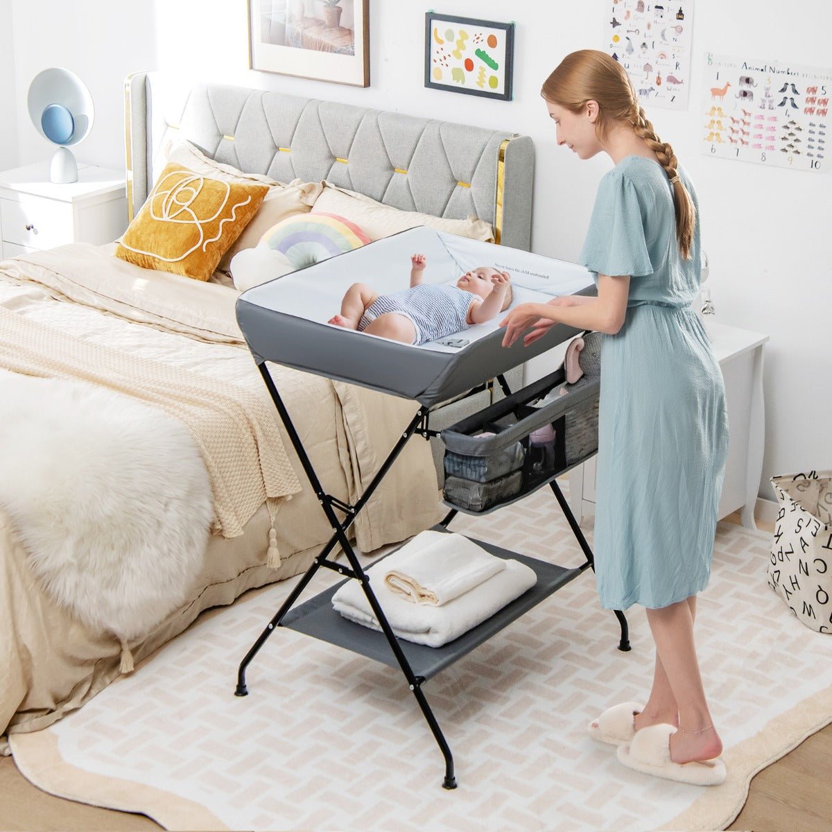 Foldable baby changing table in Grey with convenient storage, perfect for nursery organization.